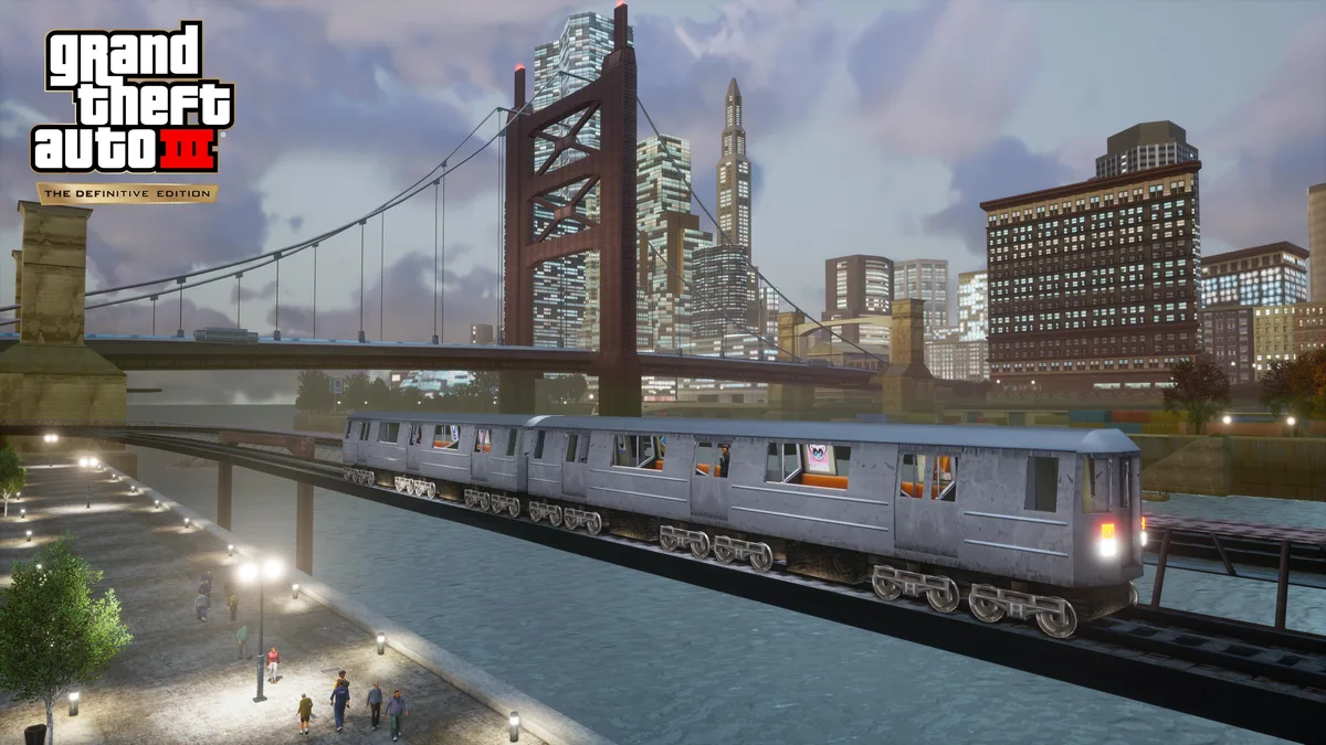 A subway train on an elevated track with a bridge behind it