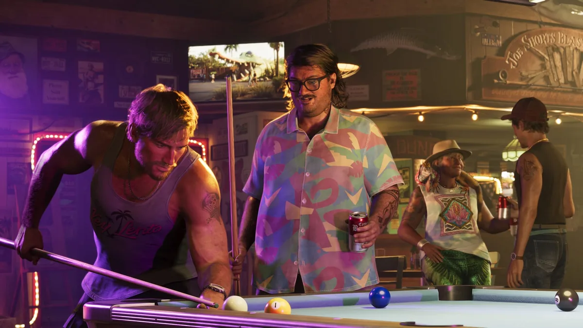 Cal Hampton with a beer and a pool cue next to Jason at a bar pool table, official GTA 6 screenshot