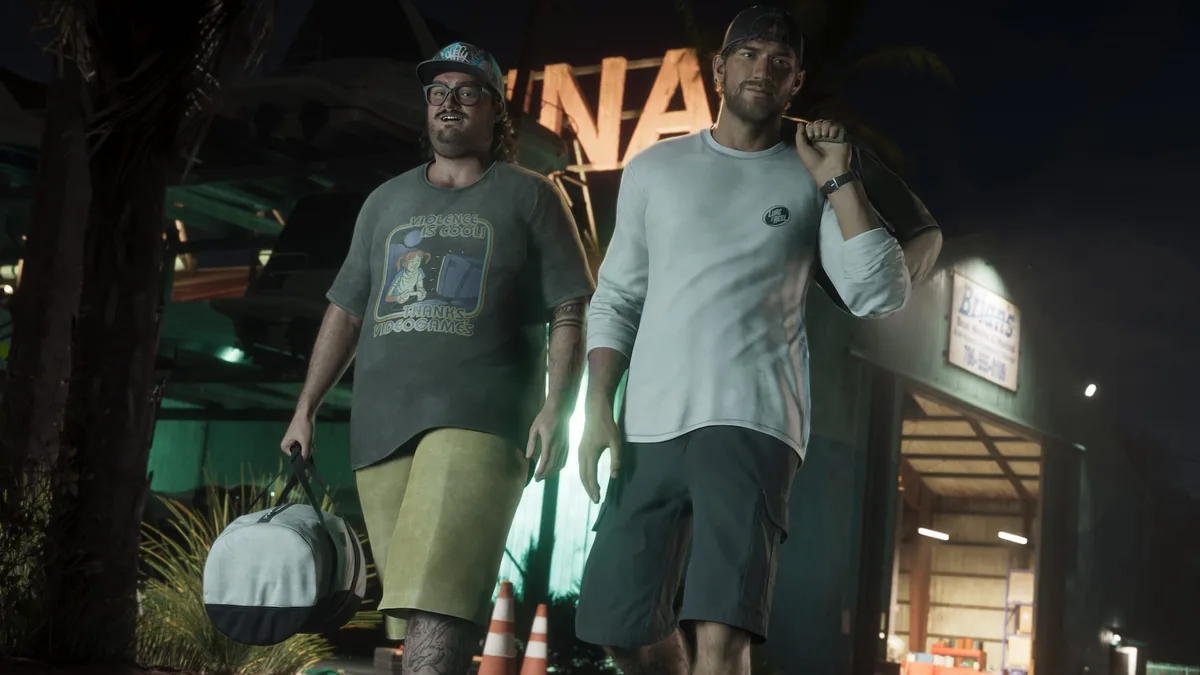 Cal Hampton carrying a duffel bag beside Jason at night in front of Brian's marina, wearing a Violence is Cool t-shirt, official GTA 6 screenshot