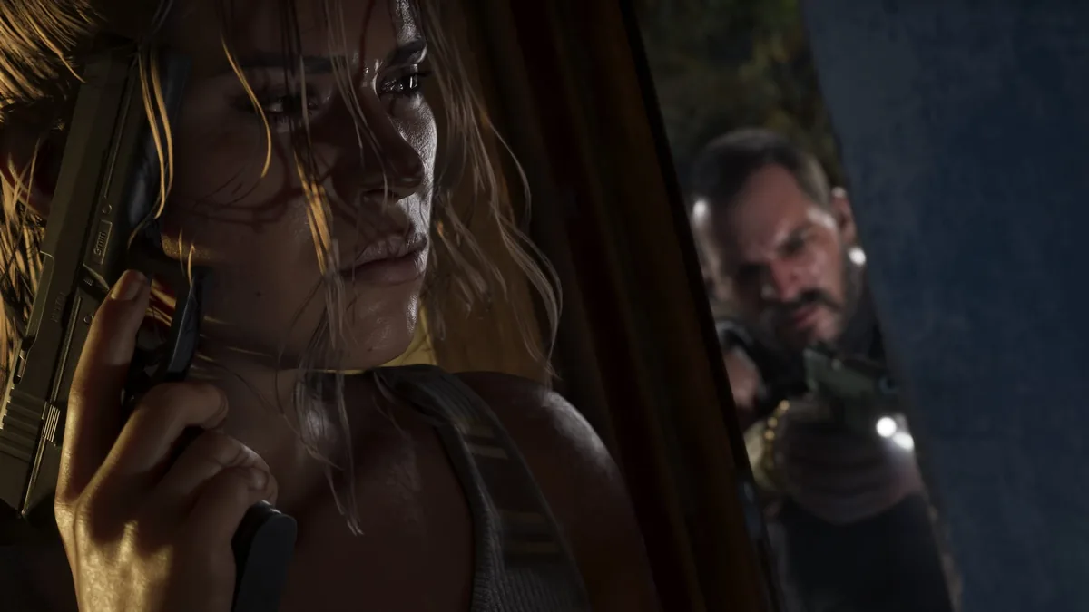 Lucia Caminos raising a pistol beside a doorway while Jason Duval covers her from behind, official GTA 6 screenshot