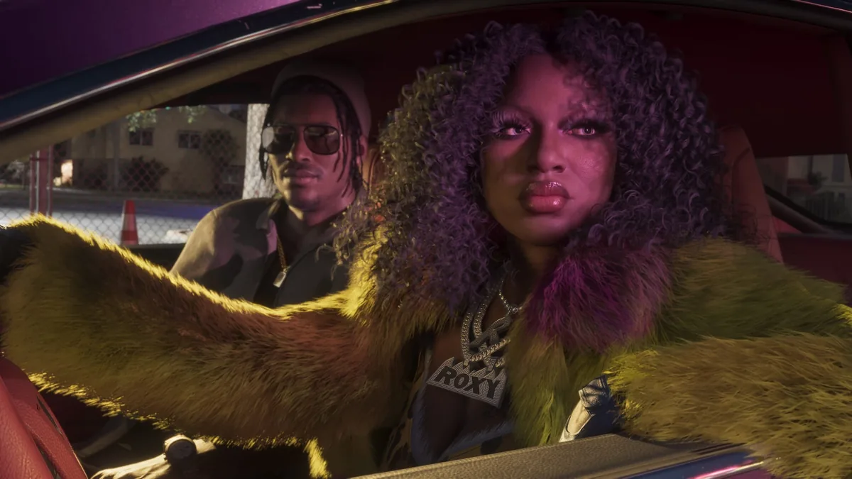 Roxy of Real Dimez in a yellow fur coat and a ROXY chain in the passenger seat of a car, Dre'Quan Priest driving, official GTA 6 screenshot