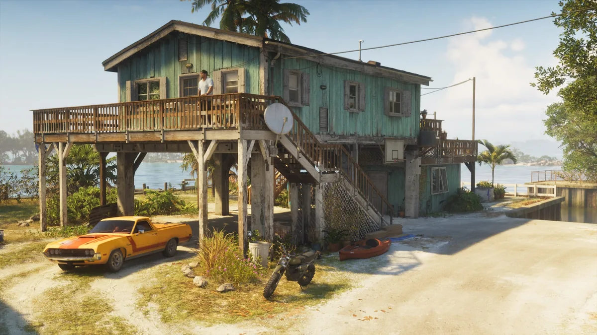 Jason's stilt house in the Leonida Keys with the yellow Vapid Ganado pickup, the green Dinka Enduro and the orange Crest kayak outside, official GTA 6 screenshot