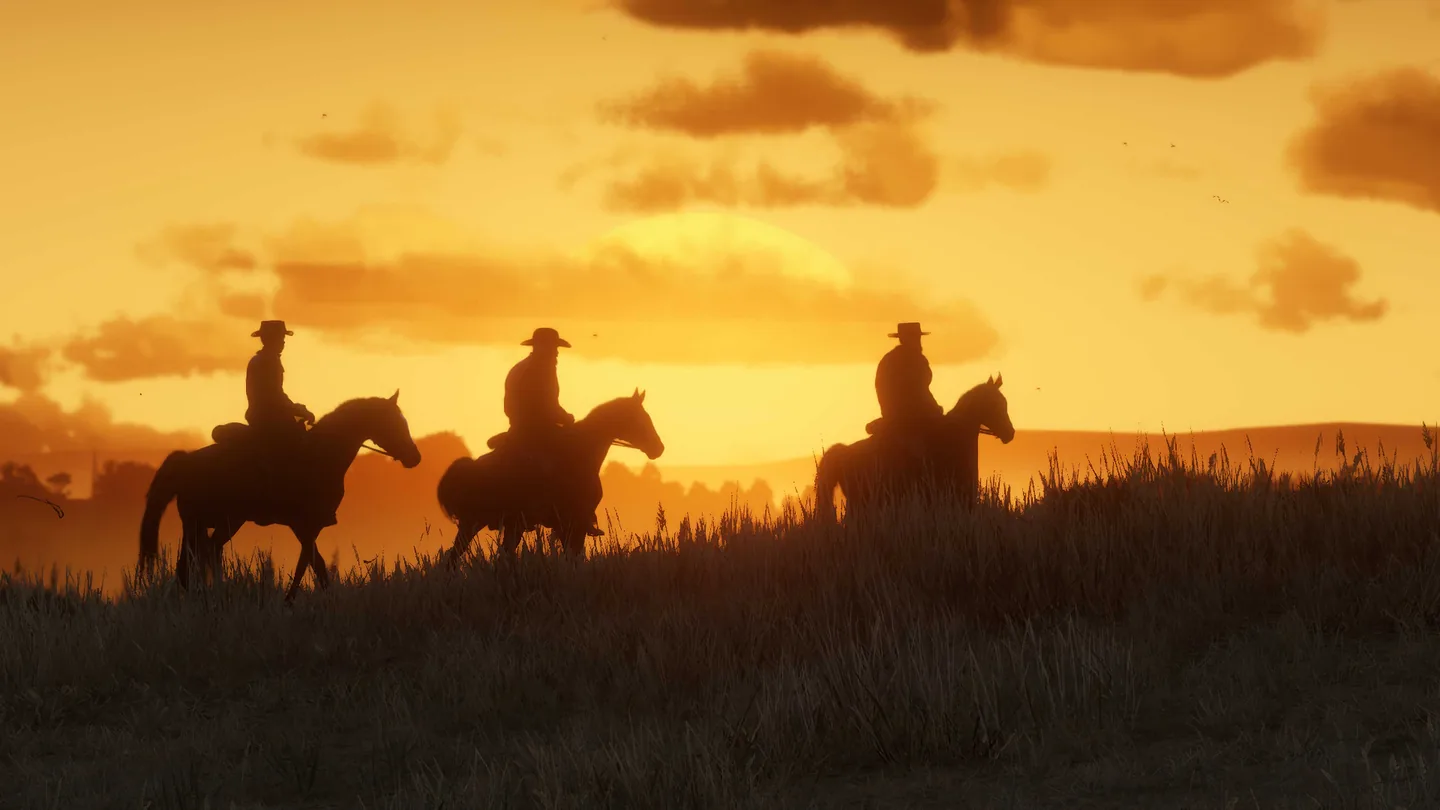 Three riders at sunset